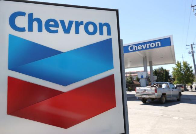 © Bloomberg. NOVATO, CALIFORNIA - JULY 31: A sign is posted in front of a Chevron gas station on July 31, 2020 in Novato, California. Chevron Corp reported a $8.27 billion loss in second quarter earnings compared to $4.3 billion in revenues one year ago. (Photo by Justin Sullivan/Getty Images) Photographer: Justin Sullivan/Getty Images North America