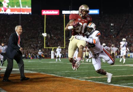 © Matthew Emmons-USA TODAY Sports. Florida State Seminoles wide receiver Rashad Greene (80) is hit by Auburn Tigers defensive back Ryan White (19) as ESPN analyst Lee Corso (left) looks on from the sideline during the first half of the 2014 BCS National Championship game at the Rose Bowl on Jan. 6, 2014. Disney, ESPN's parent, said this week it lost 3 million subscribers in the fiscal year ended Oct. 3.<br/>