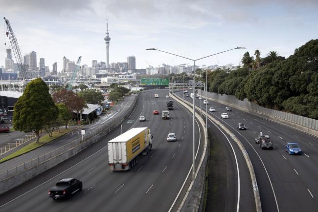 © Bloomberg. Vehicles travel along a highway during a partial lockdown imposed due to the coronavirus in Auckland, New Zealand, on Tuesday, April 28, 2020. New Zealand has emerged from almost five weeks of strict nationwide lockdown, offering a return to work for as many as half a million people and fanning hopes of a pick-up in economic activity. Prime Minister Jacinda Ardern lowered the alert level to 3, allowing workers to return to factories and construction sites and takeaway food outlets to reopen.