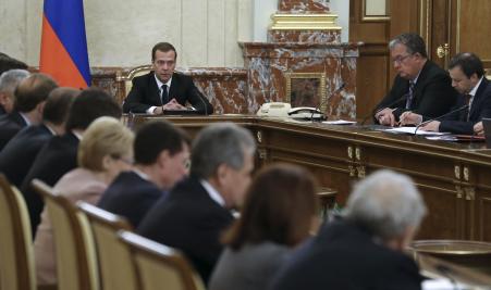 © Reuters/Ekaterina Shtukina/Sputnik/Pool. Russian Prime Minister Dmitry Medvedev (center, back) chairs a government meeting in Moscow, Russia, Nov. 26, 2015. Medvedev ordered the Russian government to draw up measures that would include freezing some joint investment projects with Turkey, in retaliation for the downing of a Russian warplane by Turkey.