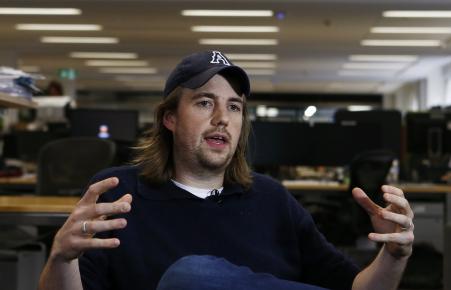 © Reuters/Daniel Munoz. Entrepreneur Mike Cannon-Brookes, co-founder and co-CEO of software firm Atlassian, gestures during a Reuters interview in central Sydney, June 5, 2013.