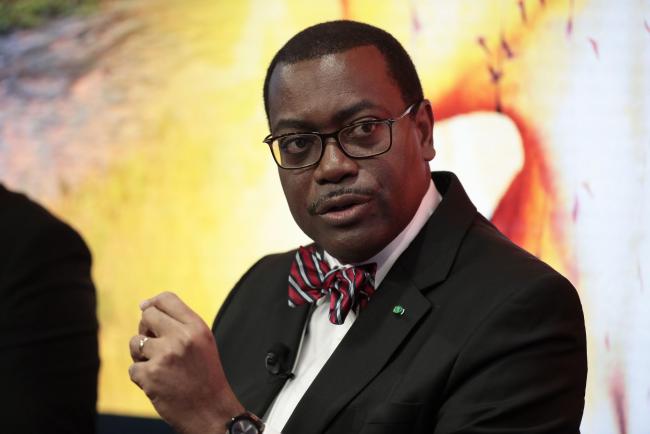 © Bloomberg. Akinwumi Ayodeji Adesina, president of the African Development Bank, speaks during a panel session at the World Economic Forum (WEF) in Davos, Switzerland, on Tuesday, Jan. 17, 2017. World leaders, influential executives, bankers and policy makers attend the 47th annual meeting of the World Economic Forum in Davos from Jan. 17 - 20.