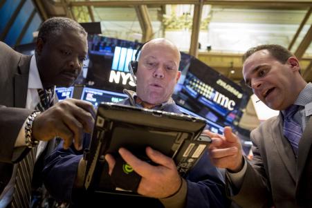 © Reuters/Brendan McDermid. Traders work on the floor of the New York Stock Exchange, Wednesday, Aug. 19, 2015.