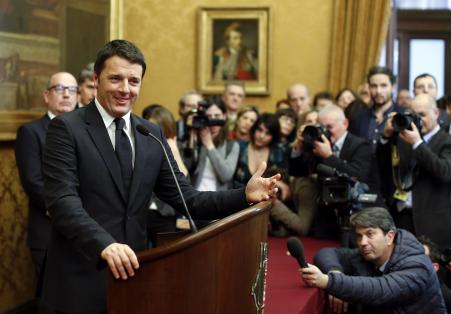 © Reuters/Tony Gentile. Italian Prime Minister-designate Matteo Renzi talks to reporters at the end of consultations with leaders of Italian parties at the Parliament in Rome on Feb.19, 2014.