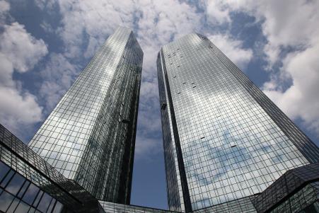 © Getty Images/DANIEL ROLAND/AFP. Seven current and one former employee of Germany's Deutsche Bank are facing tax evasion charges over their alleged participation in tax fraud schemes involving carbon emission certificates. Pictured: The headquarters buildings of Deutsche Bank, Germany's biggest lender, on June 9, 2015