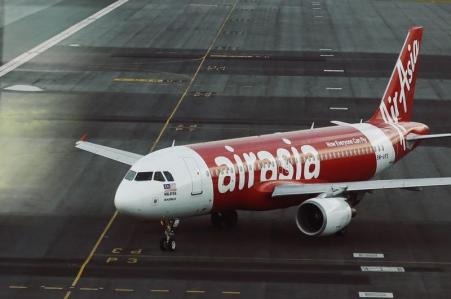 © Reuters/Olivia Harris. An AirAsia plane is seen on the runway at Malaysia's Kuala Lumpur International Airport Aug. 19, 2014.