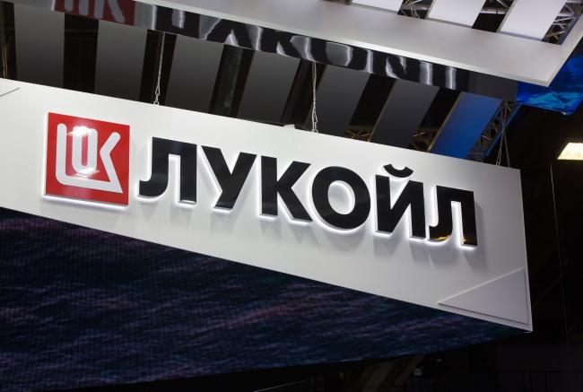 © Bloomberg. A logo sits on display above the Lukoil PJSC pavilion at the St Petersburg International Economic Forum (SPIEF) in Saint Petersburg, Russia, on Wednesday, May 23, 2018. The economic forum this year will be attended by President Vladimir Putin and French President Emmanuel Macron, and panels include everything from how to do business in Russia to biotechnology and blockchain. Photographer: Andrey Rudakov/Bloomberg