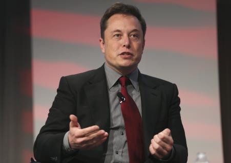 © Reuters/Rebecca Cook. Tesla Motors CEO Elon Musk talks at the Automotive World News Congress at the Renaissance Center in Detroit, Michigan, on Jan. 13, 2015.