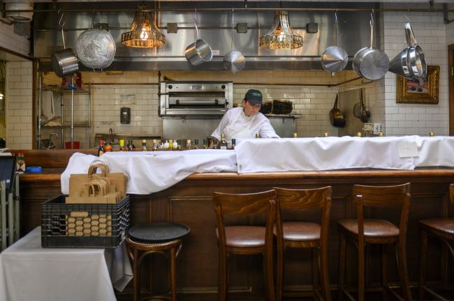 © Bloomberg. A worker prepares the kitchen at Olio e Piu restaurant in New York, U.S., on Friday, June 19, 2020. As part of so-called 
