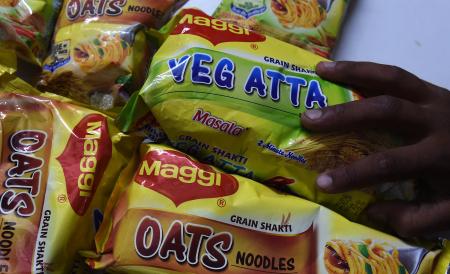 © Getty Images/AFP/Money Sharma. Nestle on Thursday announced low first-half sales growth, attributed mainly to a ban on Maggi noodles in India and a strong Swiss franc. Pictured: An Indian shopkeeper places packets of Maggi noodles in a shop in Faridabad, a suburb of New Delhi on June 11, 2015.