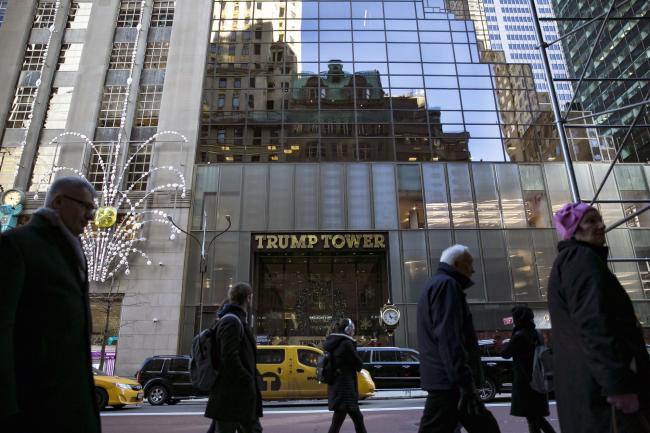 &copy Bloomberg. Pedestrians pass in front of Trump Tower in New York, U.S., on Wednesday, Dec. 19, 2018. In late November, Special Counsel Robert Mueller secured a guilty plea from Michael Cohen, Trump's former lawyer and personal fixer. That plea deal revealed that Trump was involved in trying to build a Trump tower in Moscow until at least June 2016, even though he had said publicly that he had no business dealings in Russia. Photographer: Allison Joyce/Bloomberg