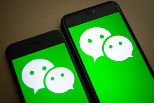 © Bloomberg. The logo for Tencent Holdings Ltd.'s WeChat app is arranged for a photograph on smartphones in Hong Kong, China, on Friday, Aug. 7, 2020. President Donald Trump signed a pair of executive orders prohibiting U.S. residents from doing business with the Chinese-owned TikTok and WeChat apps beginning 45 days from now, citing the national security risk of leaving Americans' personal data exposed. Photographer: Ivan Abreu/Bloomberg