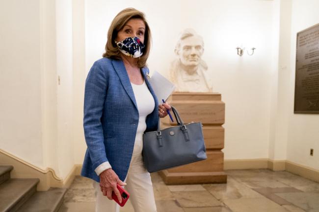 © Bloomberg. Nancy Pelosi departs her office in the U.S. Capitol in Washington, D.C., on Aug. 14.