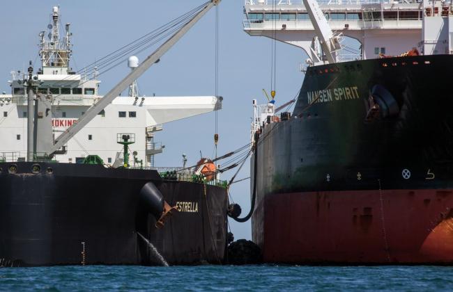 © Bloomberg. The Estrella, a crude oil tanker operated by Lundqvist Rederierna AB, left, and Nansen Spirit, a crude oil tanker operated by Teekay Corp., transfer oil between them off the coast of Southwold, U.K., on Friday, May 15, 2020. Nine tankers carrying about 5.58 million barrels of North Sea crude that loaded in April are floating off U.K. ports, according to ship-tracking data compiled by Bloomberg. Photographer: Chris Ratcliffe/Bloomberg