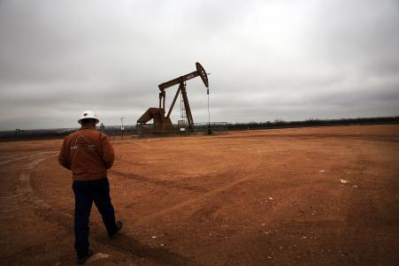 © Spencer Platt/Getty Images. An oil well in Texas' Permian Basin is seen in February 2015. Oil prices could dip this week if the Federal Reserve raises interest rates, but analysts say any immediate reaction won't affect prices in the long-term.