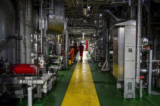 © Bloomberg. A yellow pathway marks the walking route on one of the four connected platforms on the Johan Sverdrup oil field off the coast of Norway in the North Sea, on Tuesday, Dec. 3, 2019. Sverdrup's earlier-than-expected start in October broke a long trend of underperformance for Norway's overall oil production. Photographer: Carina Johansen/Bloomberg