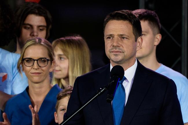 © Bloomberg. WARSAW, POLAND - JULY 12: Rafal Trzaskowski, mayor of Warsaw and presidential candidate for the center-right main opposition party, Civic Platform (PO) delivers a speech following the results from the exit polls of the second round of Poland's Presidential Election on July 12, 2020 in Warsaw, Poland. The initial results gives a slight advantage to Andrzej Duda, the ruling President who is backed by the conservative right-wing Law and Justice Party, putting him ahead of his opponent Rafal Trzaskowski, the Warsaw Mayor and Presidential candidate for the Civic Platform (PO). Experts predict that the exact result will be known on Monday, as Polish society remains extremely divide on their choice. (Photo by Omar Marques/Getty Images)