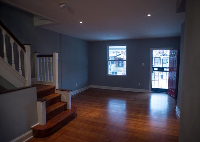 © Bloomberg. A living room is displayed inside of a newly renovated home in West Philadelphia, Pennsylvania.