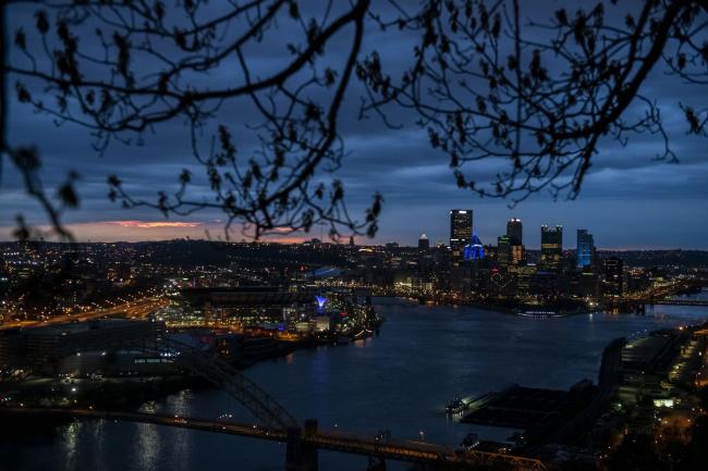 © Bloomberg. Buildings stand illuminated in Pittsburgh, Pennsylvania, U.S., on Tuesday, April 21, 2020.