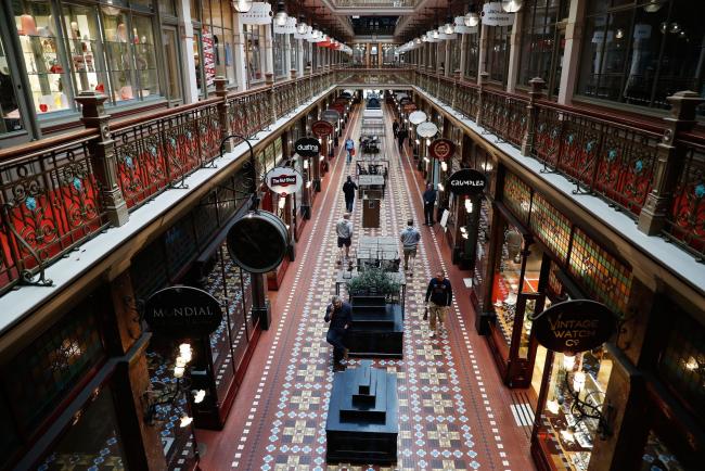 © Bloomberg. Pedestrians walk through a near-empty Strand Arcade during a partial lockdown imposed due to the coronavirus in Sydney, Australia, on Tuesday, May 5, 2020. Australia’s central bank kept the interest rate and yield objective unchanged as it braces for the shock from the shuttering of large parts of the economy to stem the spread of the coronavirus. Photographer Brendon Thorne/Bloomberg Photographer: Brendon Thorne/Bloomberg