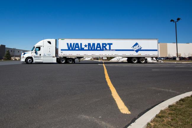 © Bloomberg. A Wal-Mart Stores Inc. truck sits parked in front of the company's fulfillment center in Bethlehem, Pennsylvania, U.S., on Wednesday, March 29, 2017. Wal-Mart Stores Inc. acquired e-commerce startup Jet.com for $3.3 billion in cash and stock. Jet.com Founder and his management team were put in charge of Wal-Mart's entire domestic e-commerce operation, overseeing more than 15,000 employees in Silicon Valley, Boston, Omaha, and its home office in Arkansas.