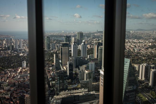 © Bloomberg. Commercial skyscraper office buildings and residential buildings stand on the city skyline seen from the Istanbul Sapphire observation deck in Istanbul, Turkey, on Wednesday, Sept. 16, 2020. Turkish bank stocks, hardest hit by a selloff of Istanbul equities from foreigners, are trading at a record discount to local industrial sectors. Photographer: Nicole Tung/Bloomberg