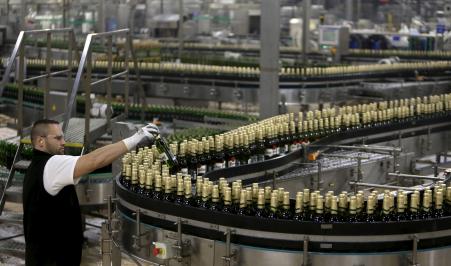 © Reuters/David W Cerny. Anheuser-Busch InBev, said it will look for buyers for SABMiller Plc's European beer brands including Peroni and Grolsch. Pictured: A worker checks bottles of beer at Plzensky Prazdroj (Pilsner Urquell) brewery in Plzen, Czech Republic, on Nov. 12, 2015.