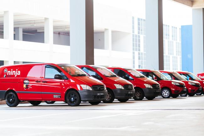 © Bloomberg. A fleet of Ninja Van's vans in Singapore. Source: handout/Bloomberg