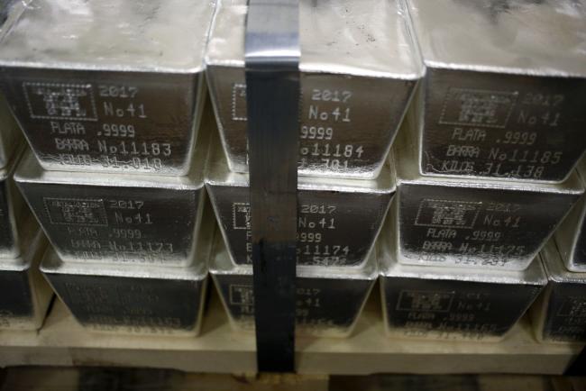 © Bloomberg. Silver bars sit inside a vault at the Rochester Silver Works LLC (RSW) facility in Rochester, New York, U.S., on Thursday, March 30, 2017. Rochester Silverworks LLC is a world leader in film recycling and silver chemical manufacturing. Photographer: Luke Sharrett/Bloomberg