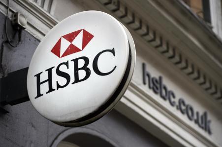 © Getty Images/AFP/NIKLAS HALLE'N. HSBC Holdings Plc reported a better-than-expected third-quarter pre-tax profit of .1 billion, up from .6 billion a year earlier. Pictured: A HSBC bank logo is seen on a sign outside a branch of the bank in London, Oct. 22, 2015.