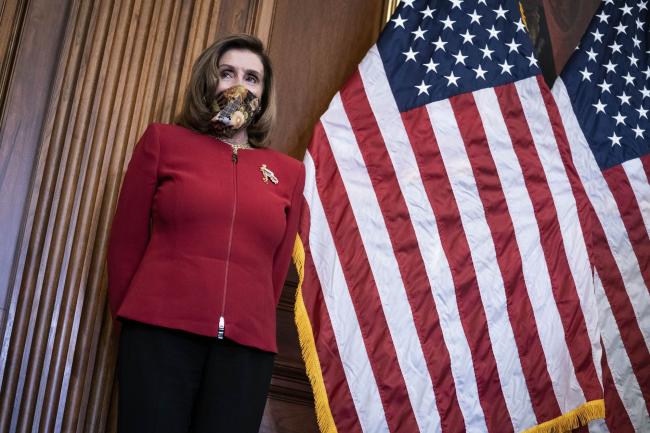 © Bloomberg. House Speaker Nancy Pelosi, a Democrat from California, wears a protective mask during a news conference in Washington, D.C., U.S., on Thursday, Sept. 17, 2020. Pelosi rejected calls from some House Democratic moderates to hold a vote on a new, smaller stimulus bill and doubled down on her push to get the White House to agree to a $2.2 trillion package.