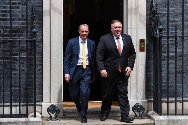 © Bloomberg. Michael Pompeo, U.S. secretary of state, right, and Dominic Raab, U.K. foreign secretary, depart from number 10 Downing Street in London, U.K., on Tuesday, July 21, 2020. Senior lawmakers will seek to use a visit to London by Pompeo to press U.K. Prime Minister Boris Johnson to take an even harder stance on China.