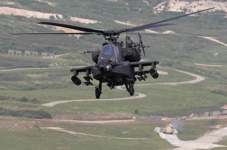 © Reuters/Jo Yong-Hak. A U.S. AH-64 Apache helicopter flies above a U.S. M2A3 Bradley infantry fighting vehicle during a joint live firing exercise between South Korea and the U.S. at the U.S. Army's Rodriguez Live Firing Range in Pocheon, about 46 km (28 miles) northeast of Seoul and about 15 km (9 miles) south of the demilitarized zone separating the two Koreas, on Sept. 1, 2011.