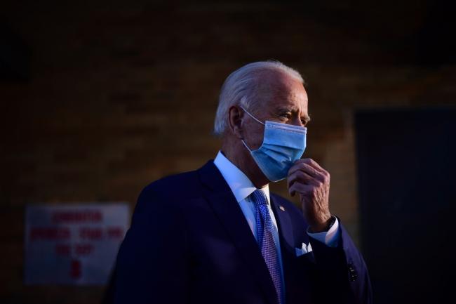 © Bloomberg. WILMINGTON, DE - NOVEMBER 24: President-elect Joe Biden speaks with the media as he departs the Queen Theater after introducing key foreign policy and national security nominees and appointments on November 24, 2020 in Wilmington, Delaware. As President-elect Biden waits to receive official national security briefings, he is announcing the names of top members of his national security team to the public. Calls continue for President Trump to concede the election as the transition proceeds. (Photo by Mark Makela/Getty Images)