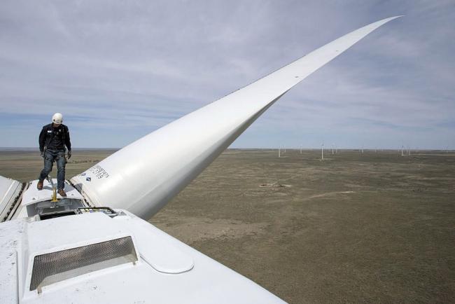 © Bloomberg. A General Electric Co. renewable energy technician walks on a turbine at the Colorado Highlands Wind Farm in Fleming, Colorado, U.S., on Thursday, May 5, 2016. Wind technicians are forecast to be the country's fastest-growing occupation through 2024, outpacing health care and technology fields, according to the U.S. Bureau of Labor Statistics. Bloomberg Bloomberg Bloomberg