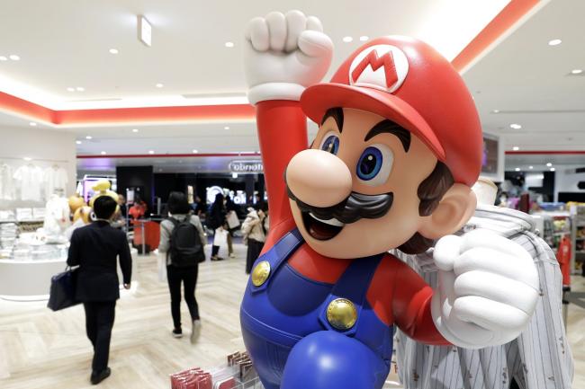 © Bloomberg. A statue of the Nintendo Co. video-game Super Mario Brothers character Mario sits on display inside the Nintendo TOKYO store during a media tour in Tokyo, Japan, on Tuesday, Nov. 19, 2019. Nintendo's first official store in Japan is due to open in the Shibuya Parco department store, operated by Parco Co., when it re-opens on Nov. 22. Photographer: Kiyoshi Ota/Bloomberg