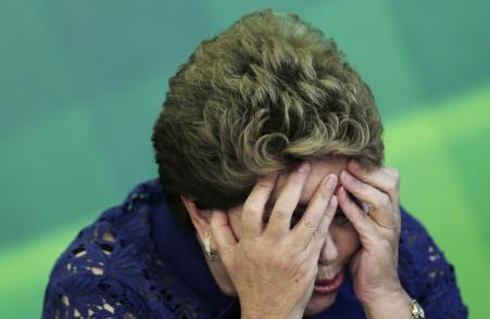 © Reuters/Joedson Alves. Brazilian President Dilma Rousseff reacts during a breakfast meeting with the media at the Planalto Palace in Brasilia, Dec. 22, 2014. When investigators first identified signs of corruption at Petrobras in 2009, she insisted the state-run oil company had nothing to hide.