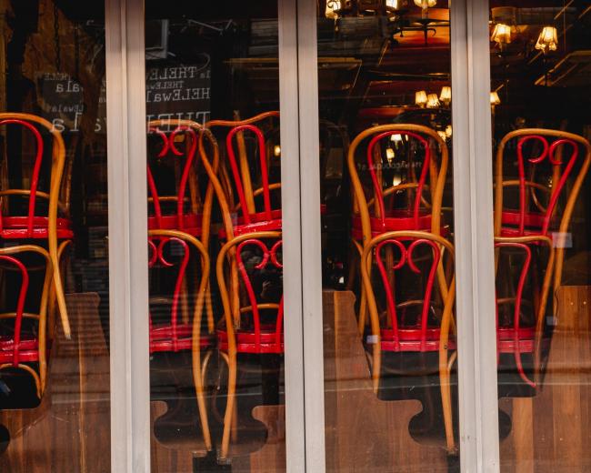 © Bloomberg. Chairs sit stacked inside a closed Mexican restaurant on MacDougal street in the Greenwich Village neighborhood of New York. Photographer: George Etheredge/Bloomberg