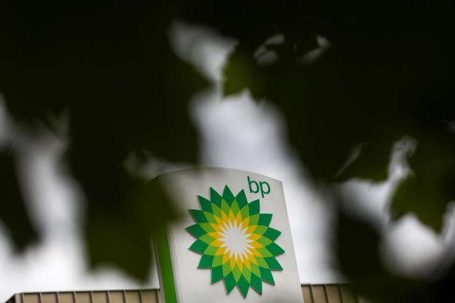 © Bloomberg. A BP Plc logo sits at the top of a totem sign at a filling station in London, U.K., on Monday, June 8, 2020. BP Plc plans to cut 10,000 jobs as the coronavirus pandemic accelerates the company's move to slim down for the energy transition.