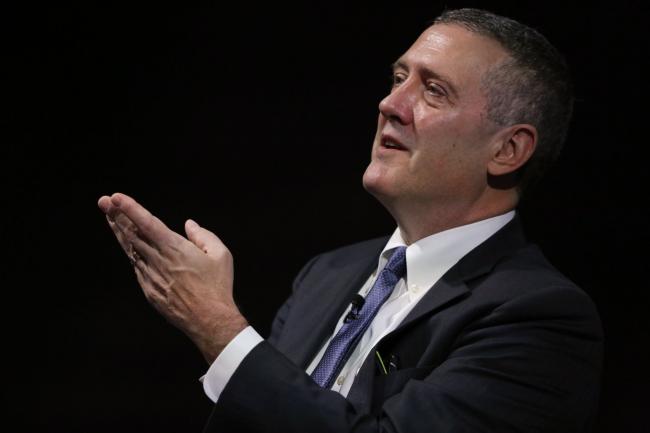 © Bloomberg. James Bullard, president and chief executive officer of the Federal Reserve Bank of St. Louis, gestures while speaking at the 2019 Monetary and Financial Policy Conference at Bloomberg's European headquarters in London, U.K., on Tuesday, Oct. 15, 2019. Bullard said U.S. policy makers are facing too-low rates of inflation and the risk of a greater-than-expected slowdown, suggesting he’d favor an additional interest rate cut as insurance.