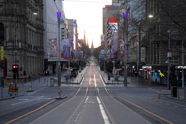 © Bloomberg. MELBOURNE, AUSTRALIA - AUGUST 11: A very quiet Bourke Street is seen on August 11, 2020 in Melbourne, Australia. Metropolitan Melbourne is under stage 4 lockdown restrictions, with people only allowed to leave home to give or receive care, shopping for food and essential items, daily exercise and work, while an overnight curfew from 8pm to 5am is also in place. The majority of retail businesses are also closed. Other Victorian regions are in stage 3 lockdown. The restrictions, which came into effect from 2 August, have been introduced by the Victorian government as health authorities work to reduce community COVID-19 transmissions across the state. (Photo by Quinn Rooney/Getty Images)