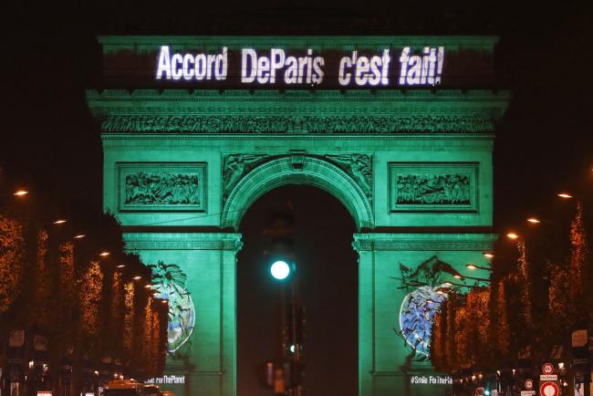 © Bloomberg. The Arc de Triomphe in Paris on Nov. 4, 2016. America’s withdrawal prompted concerns that other nations would follow. Photographer: Patrick Kovarik/AFP/Getty Images