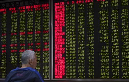 © Reuters/China Daily. Asian stock markets were set to see one of their worst quarters in years amid weakening economic growth from China. Pictured: An investor sits in front of an electronic board showing stock information at a brokerage house in Beijing, China, on Sept 25, 2015.
