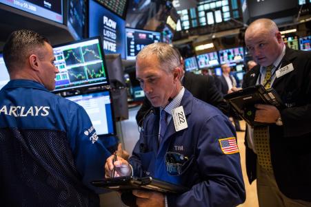 © Andrew Burton/Getty Images. Investment bank Goldman Sachs has lowered its S&P 500 forecast and predictions for U.S. economic growth. Pictured: A trader worked on the floor of the New York Stock Exchange during the afternoon of Sept. 28, 2015, in New York City.