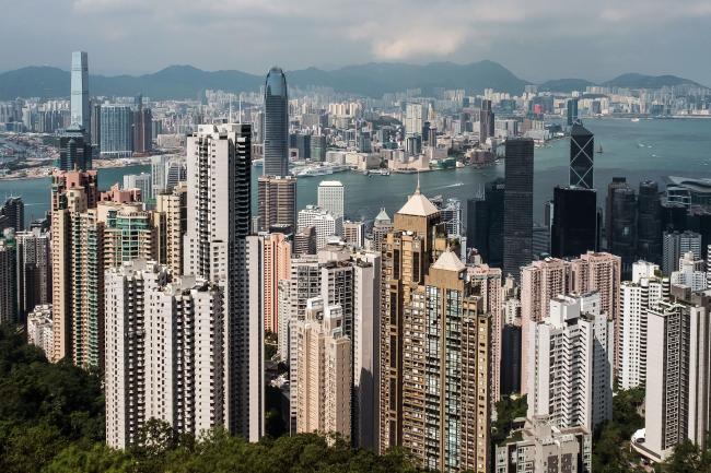 © Bloomberg. Residential and commercial buildings are seen from Victoria Peak in Hong Kong, China, on Monday, Sept. 11, 2017. Hong Kong stocks fluctuated on Sept. 12 as automakers extended gains driven by China's plan to phase out fossil-fuel vehicles, while banks and property companies weighed on the benchmark index. Photographer: Billy H.C. Kwok/Bloomberg