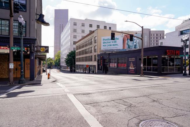 © Bloomberg. West Burnside Street stands nearly empty in Portland, Oregon, U.S., on Wednesday, June 17, 2020. Oregon's Multnomah County, where much of Portland lies, was set to enter Phase 1 of reopening on June 12. But Governor Kate Brown announced the night before that the reopening would be delayed. Photographer: Rebecca Smeyne/Bloomberg