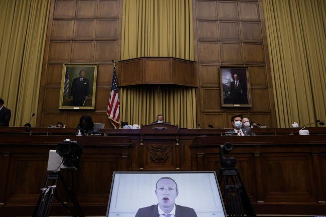 © Bloomberg. Mark Zuckerberg, chief executive officer and founder of Facebook Inc., speaks via videoconference during a House Judiciary Subcommittee hearing in Washington, D.C., U.S., on Wednesday, July 29, 2020. Chief executives from four of the biggest U.S. technology companies face a moment of reckoning in an extraordinary joint appearance before Congress that will air bipartisan concerns that they are using their dominance to crush rivals at the expense of consumers.