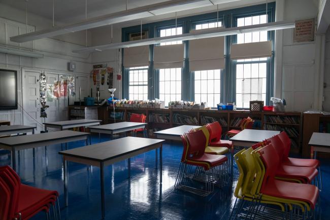 © Bloomberg. Stacked chairs sit in a classroom during summer break at a public elementary school in the Brooklyn borough of New York, U.S., on Wednesday, Aug. 19, 2020. New York City's public schools can hold in-person classes this fall, Governor Andrew Cuomo announced, paving the way for the district to become the only major U.S. system to open its doors despite growing unease among teachers, administrators and parents. Photographer: Jeenah Moon/Bloomberg