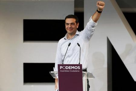 © REUTERS/Juan Medina. Alexis Tsipras, leader of Greece's Syriza party, gestures during a meeting in central Madrid Nov. 15, 2014.