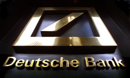 © Mario Tama/Getty Images. The Deutsche Bank headquarters sign is seen on July 11, 2001. The company announced Oct. 18, 2015, several senior-level management changes and restructuring plans.